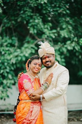 Newlyweds smiling and embracing outdoors
