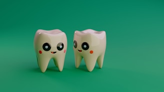 Two cartoon teeth smiling on a green background