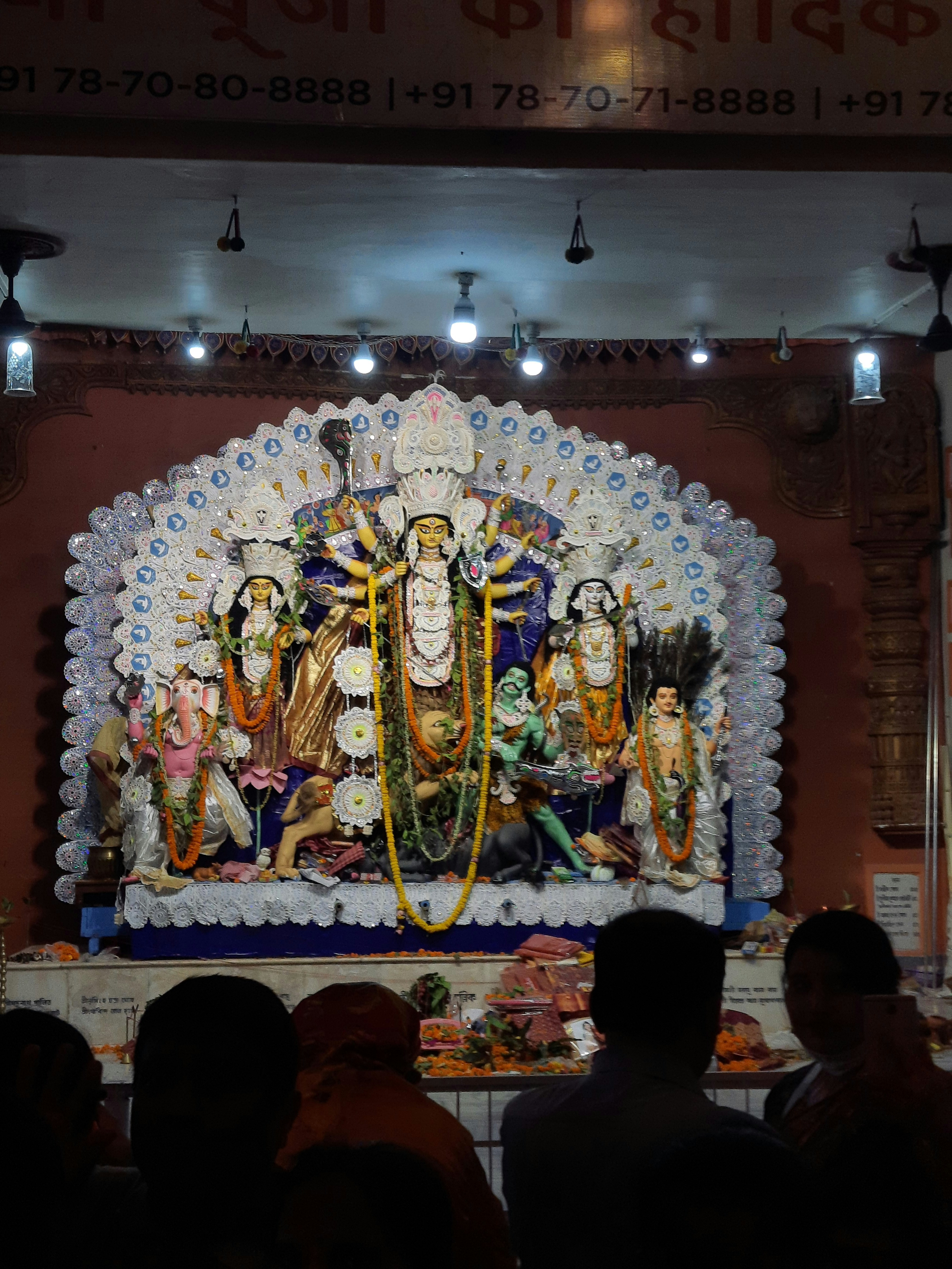 Idol of goddess durga with her children at a temple.