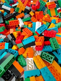 Pile of colorful building blocks scattered randomly.