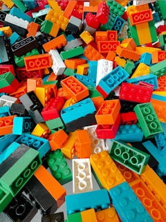 Pile of colorful building blocks scattered randomly.