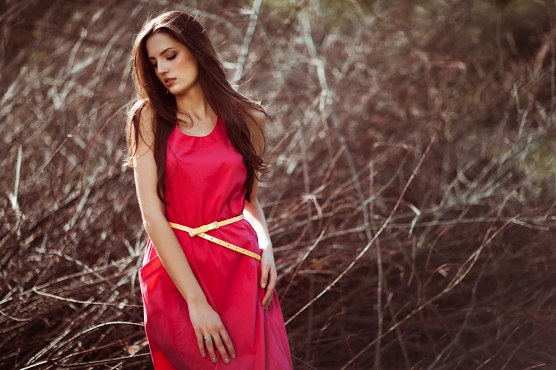 Elegant woman in pink dress outdoors