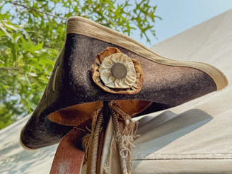 Tricorn hat with rosette and tassels