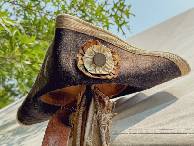 Tricorn hat with rosette and tassels