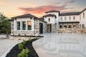 Modern luxury house with stone accents at sunset