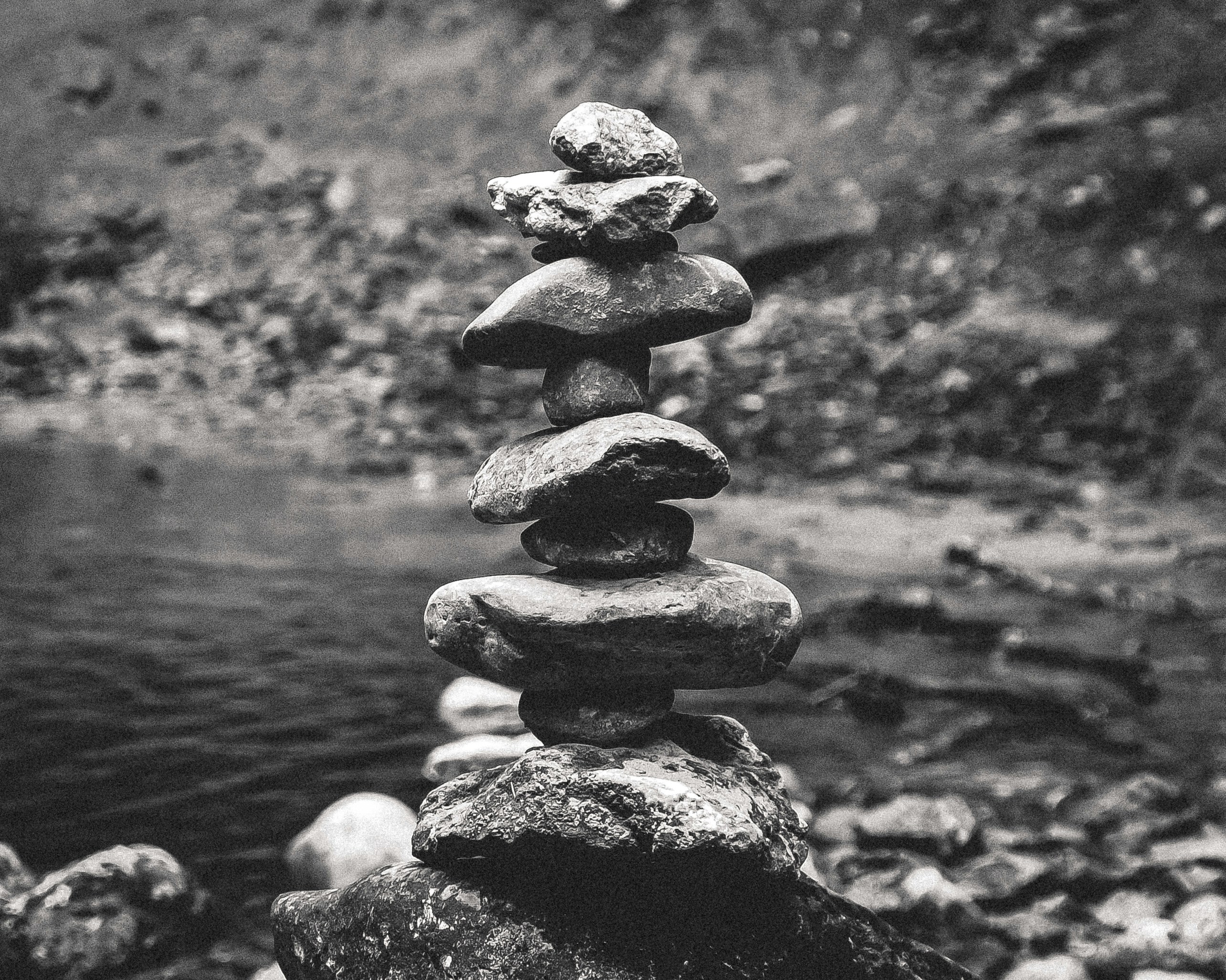Stack of balanced stones near water