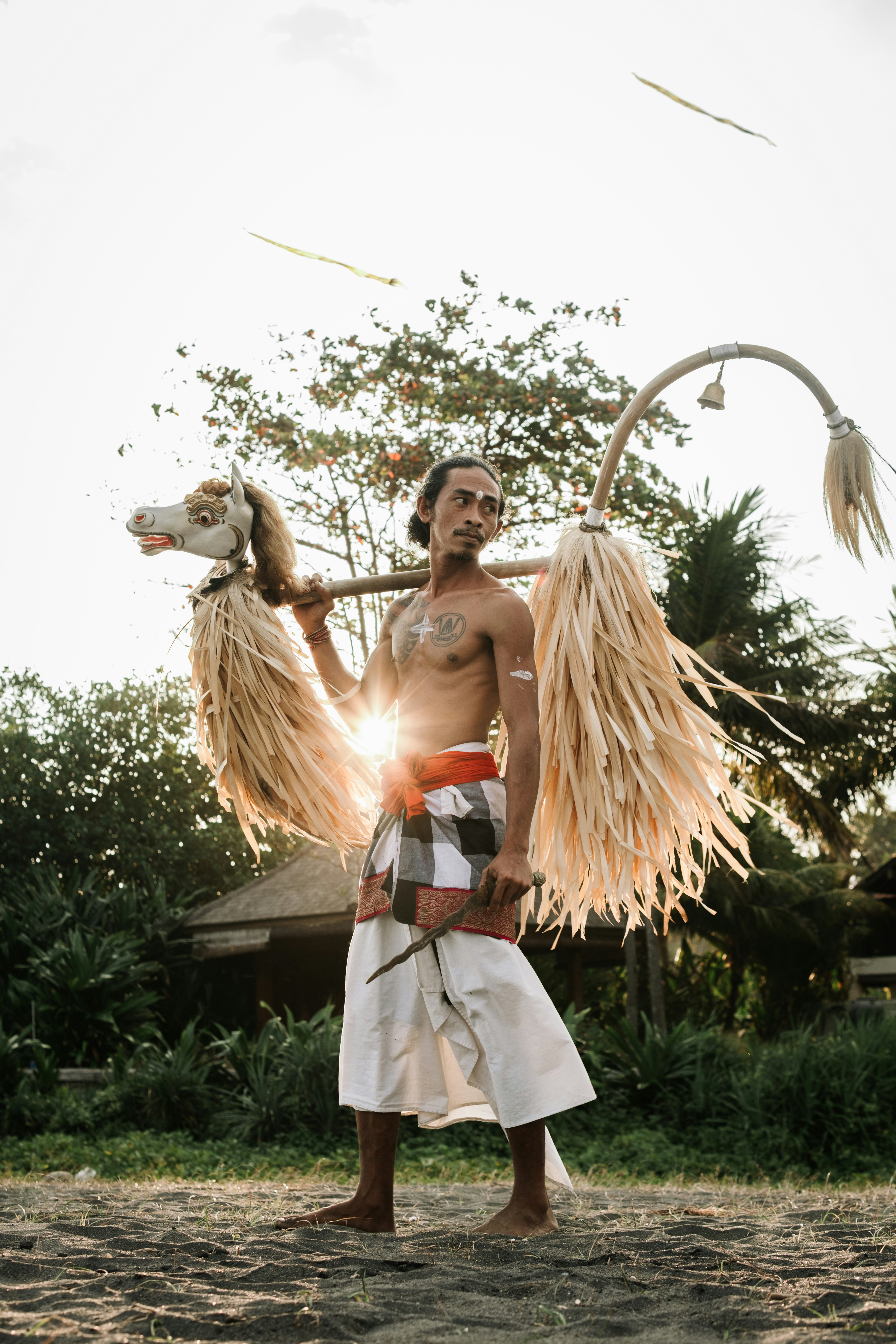 Man carries a traditional balinese horse puppet