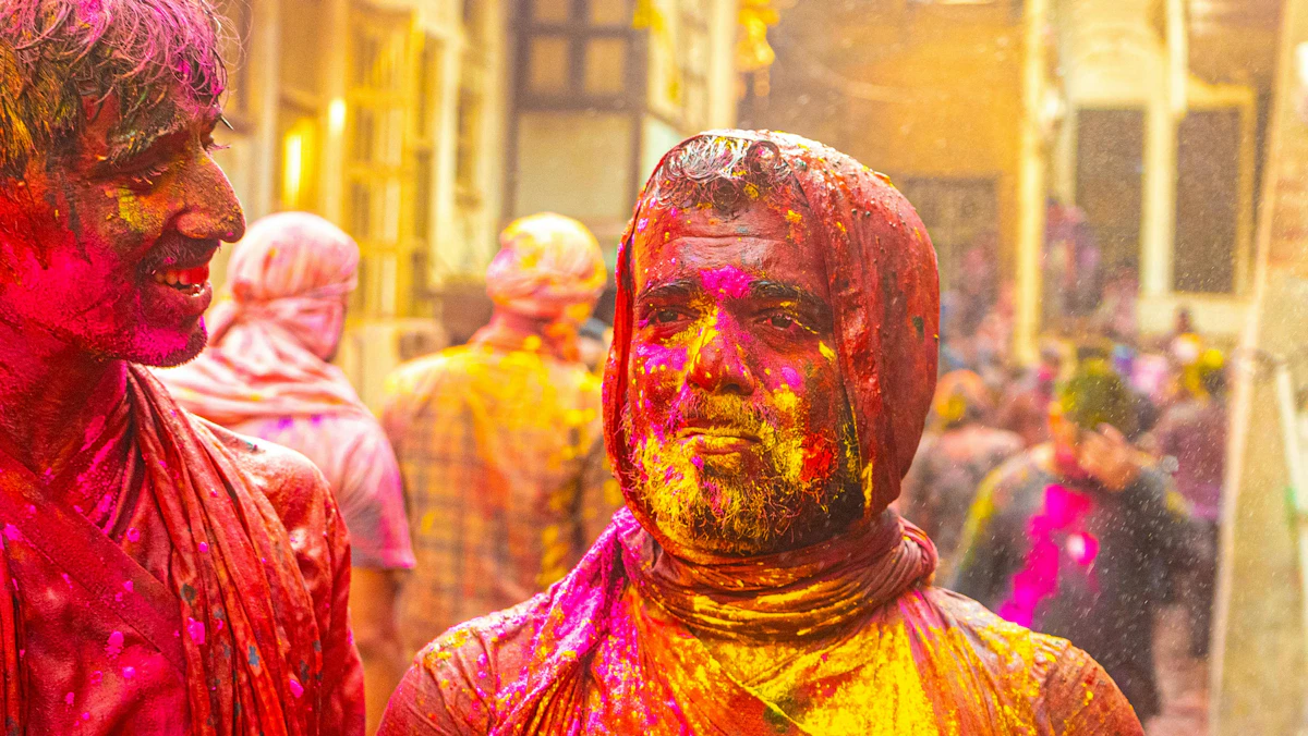 Faces covered in Holi colours during celebrations in north India