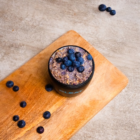 Bowl of oatmeal topped with fresh blueberries