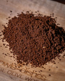 A pile of finely ground coffee beans