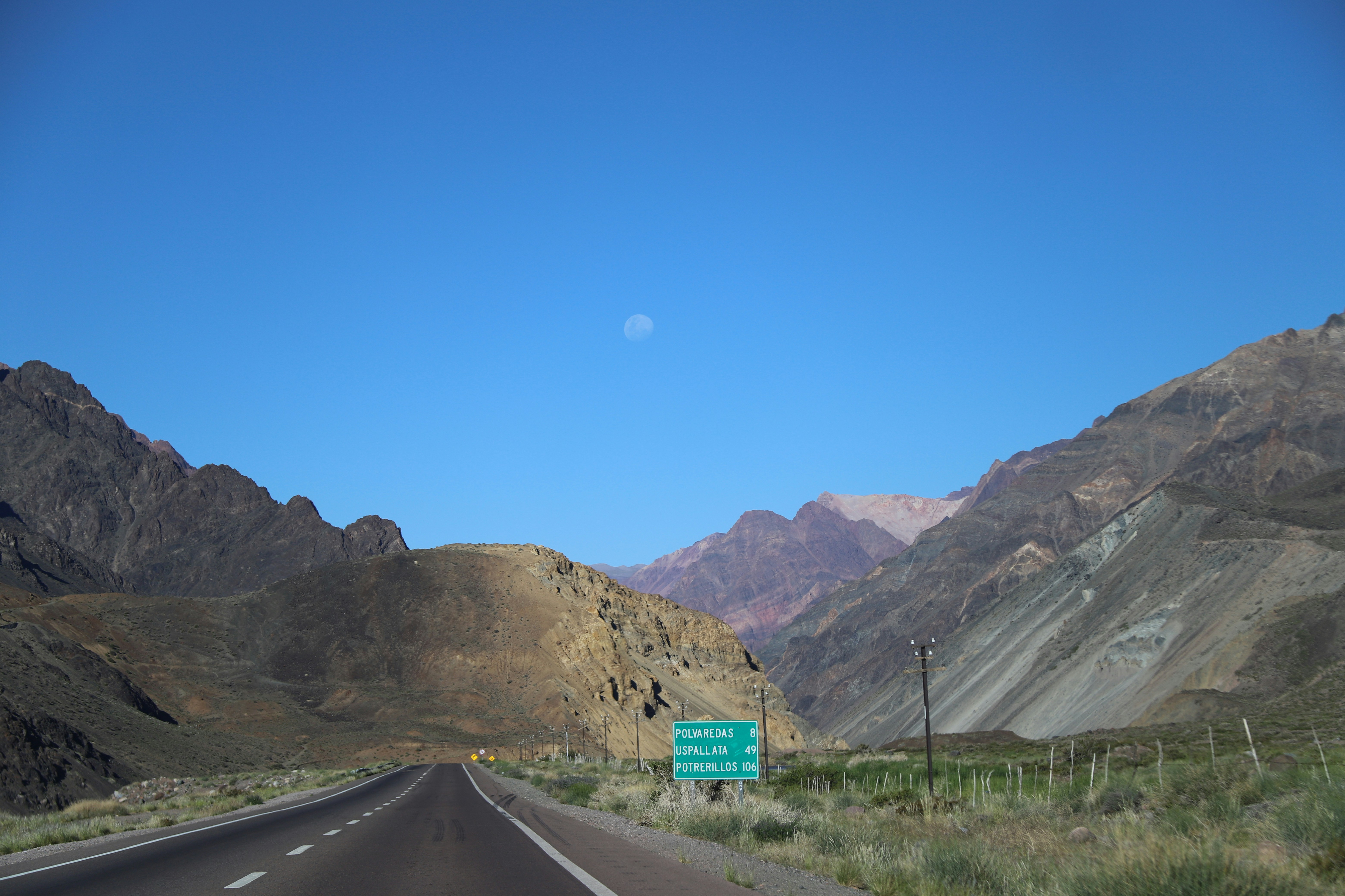 Hero image for Desert Escape: 3 Days from Las Vegas to Red Rock Canyon - Highway through mountains with a clear blue sky. -  in Southwestern Nevada - Photo by Natalia Bazyl on Unsplash