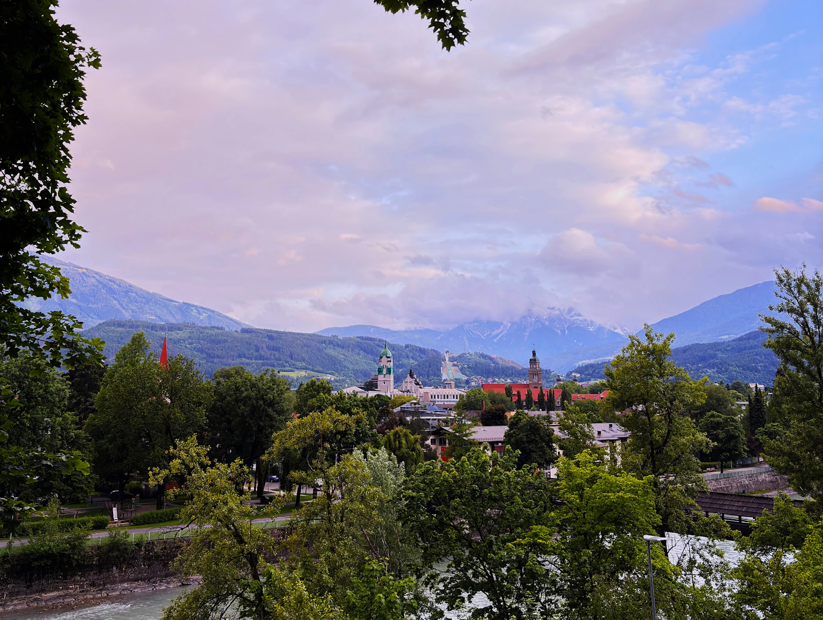 Innsbruck nestled beneath green and snowy mountains