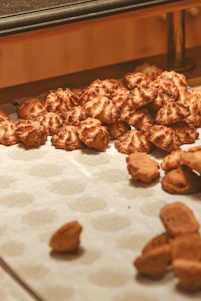 Pile of freshly baked cookies on a counter.