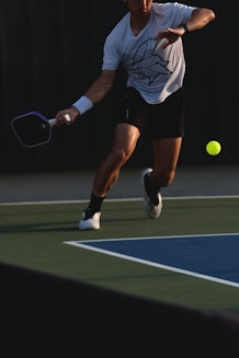 Man playing pickleball on a court