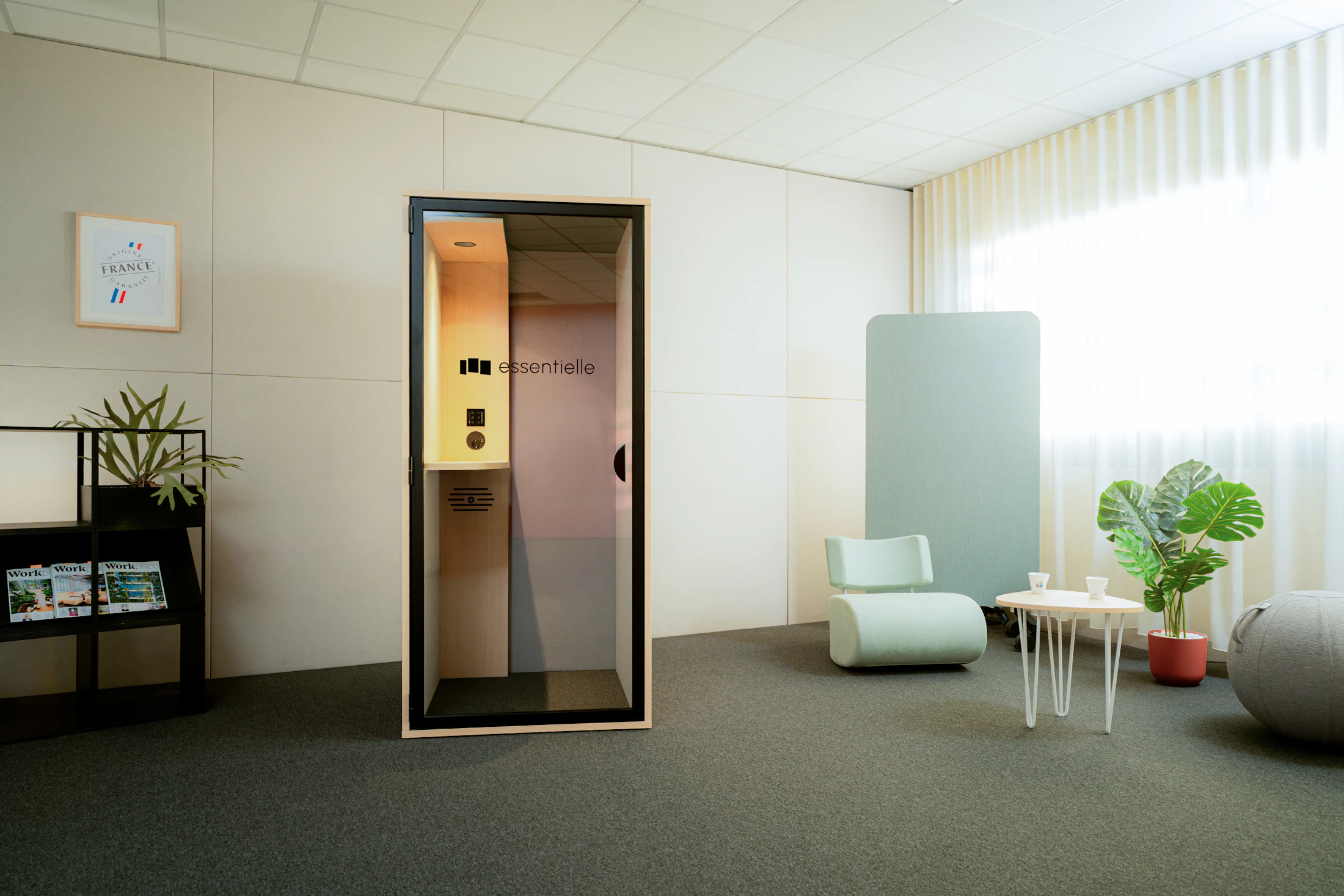 Office acoustic booth, privacy panel, lounge chair, and workspace plants