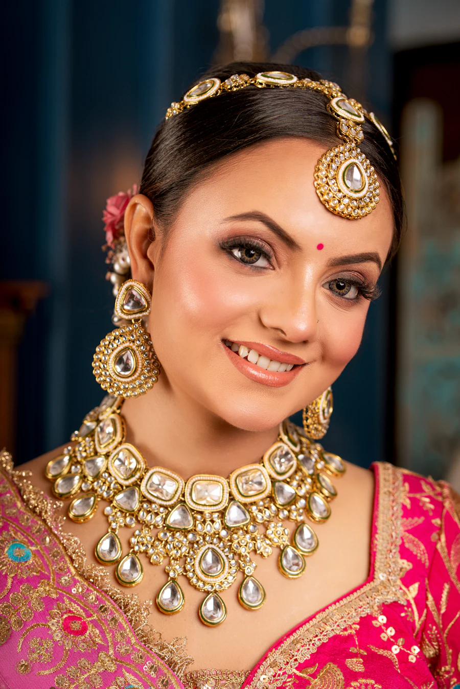 Bride wearing a traditional kundan and polki bridal jewelry set