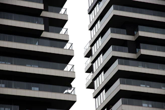 Modern buildings with balconies against a white sky