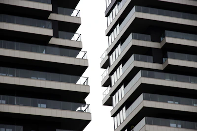 Modern buildings with balconies against a white sky