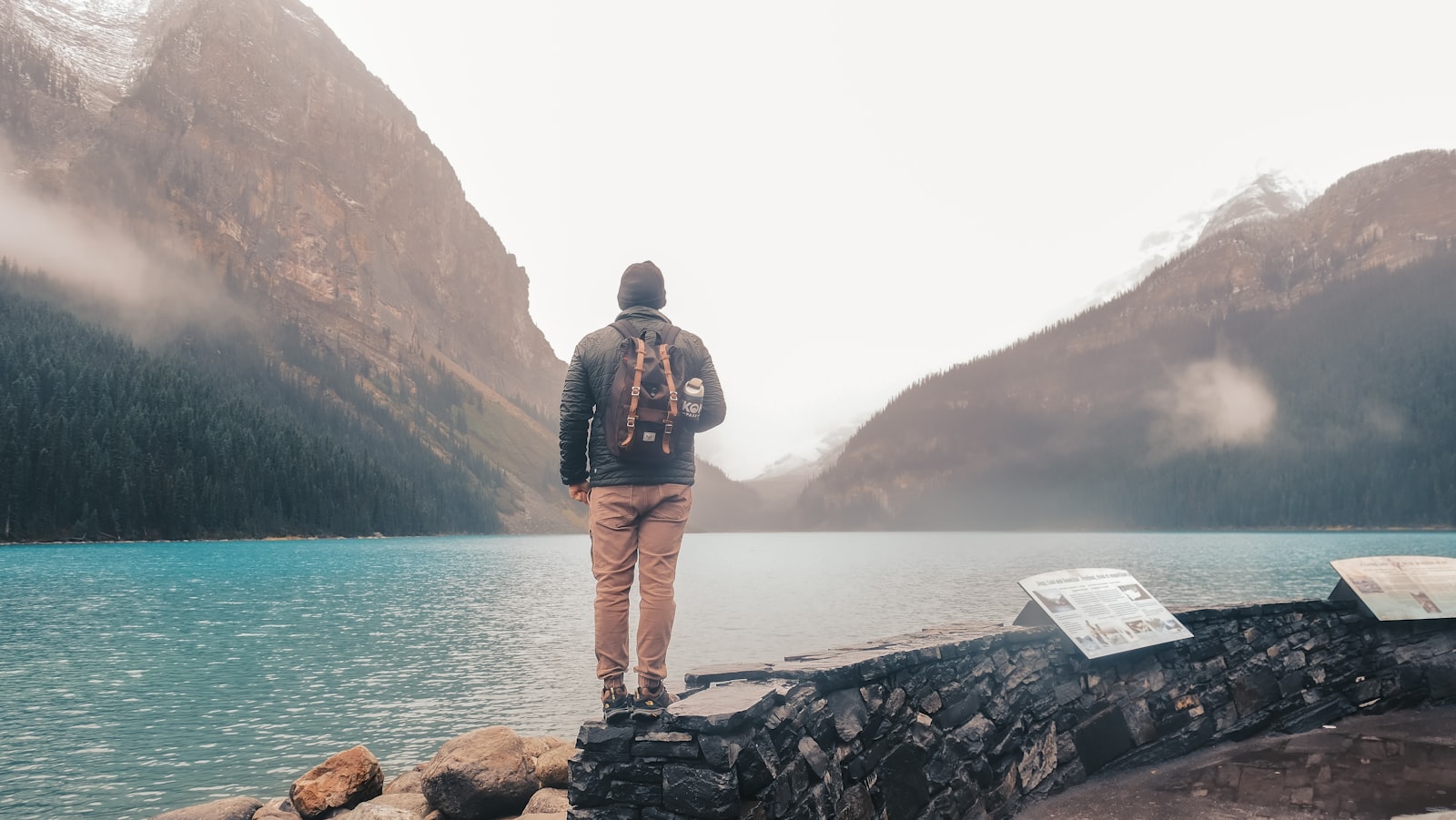 Traveler exploring mountains and lake — FIT tour experiences made possible by smart back office automation