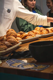 Assortment of croissants displayed on trays.