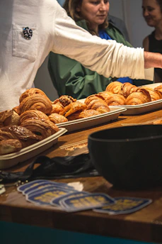 Assortment of croissants displayed on trays.