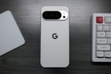 White smartphone with google logo and camera array.