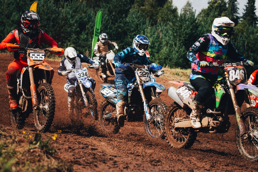Motocross racers battling on a dirt track