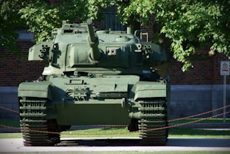 A green military tank parked outdoors