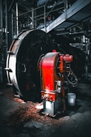 Industrial machinery with red metal components