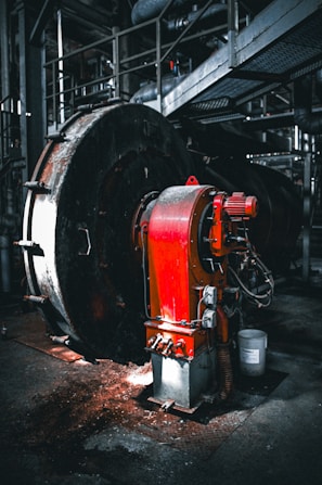 Industrial machinery with red metal components