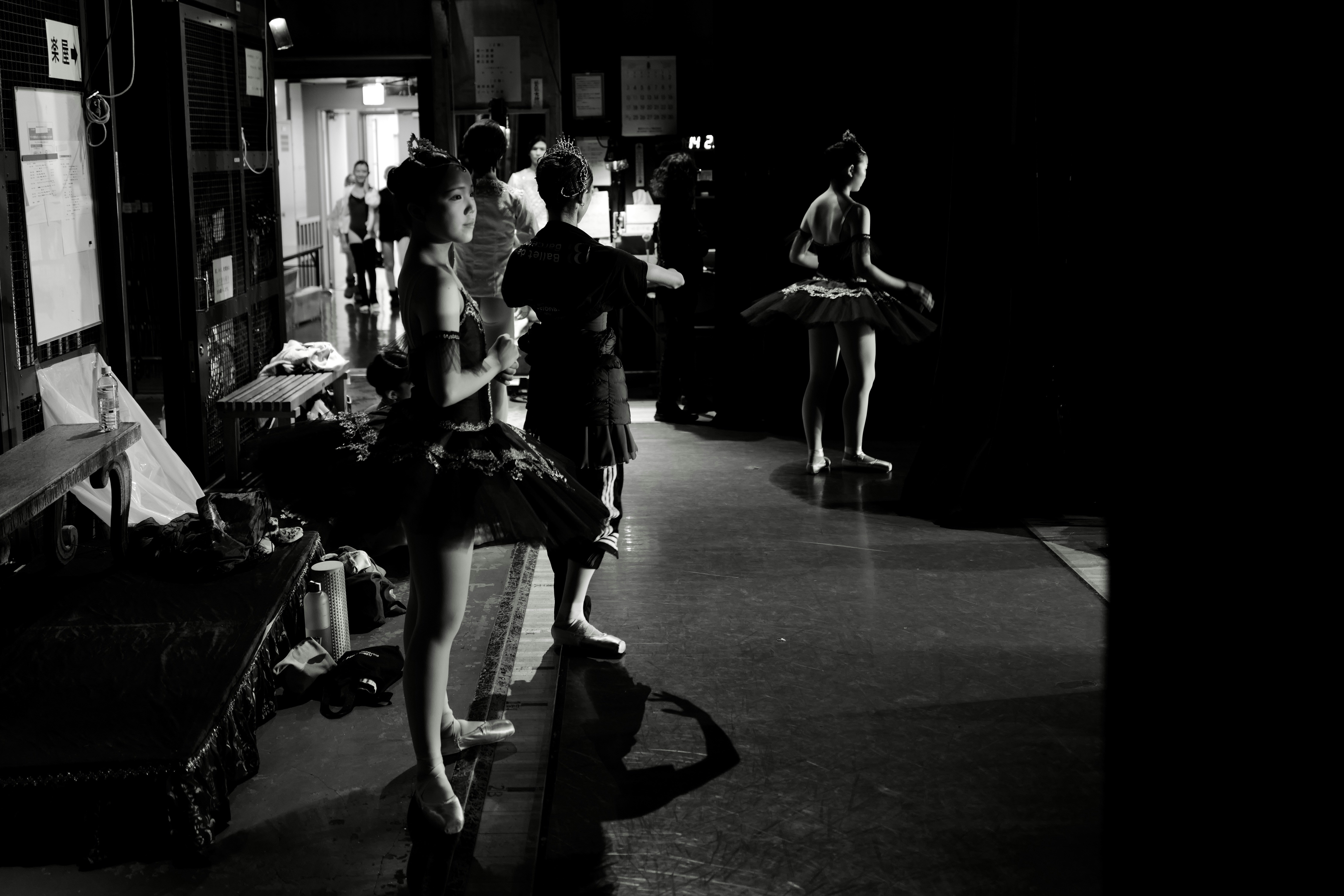 Ballet dancers in tutus backstage before a performance