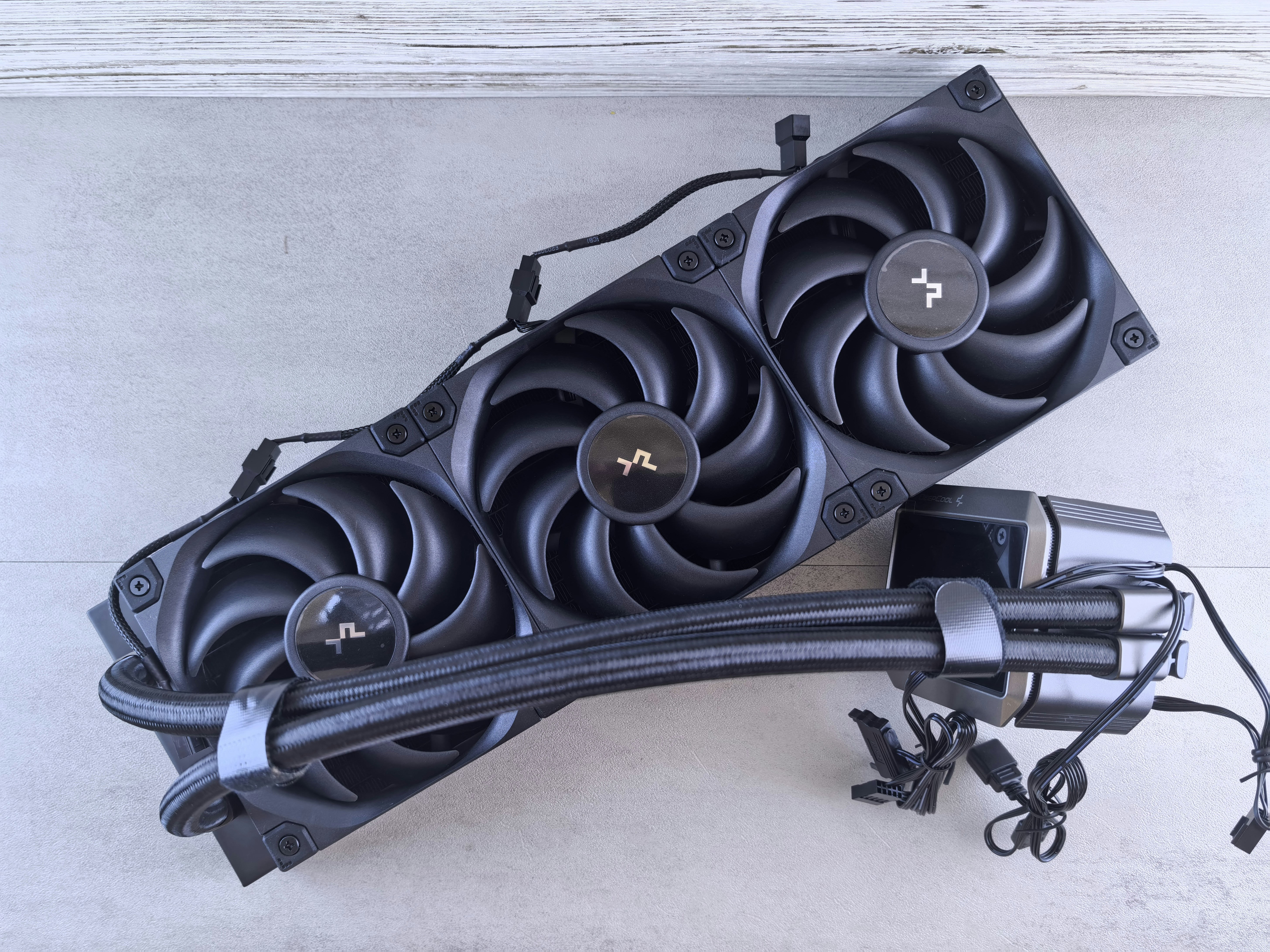 Black computer cooling fan with three rotors.
