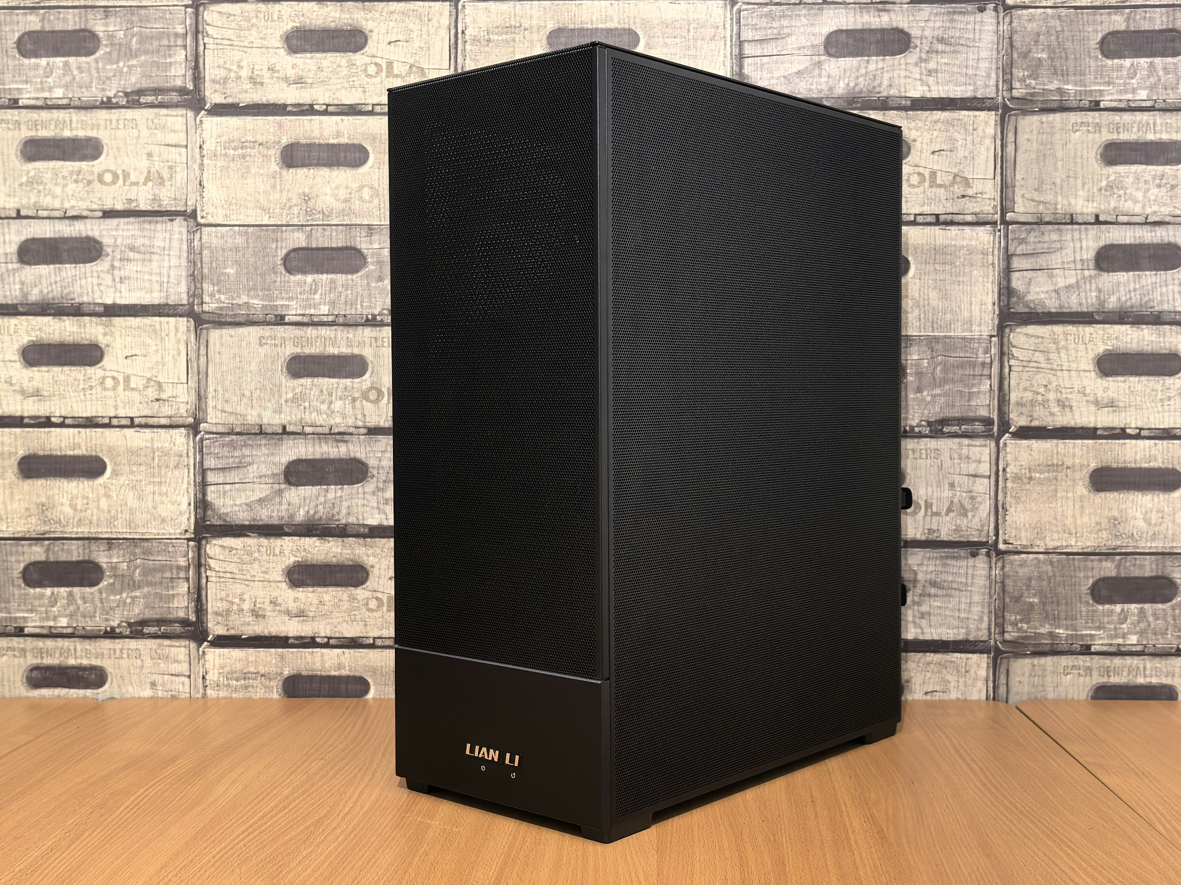 Black computer tower case on wooden surface