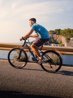 Man riding a bicycle on a sunny day