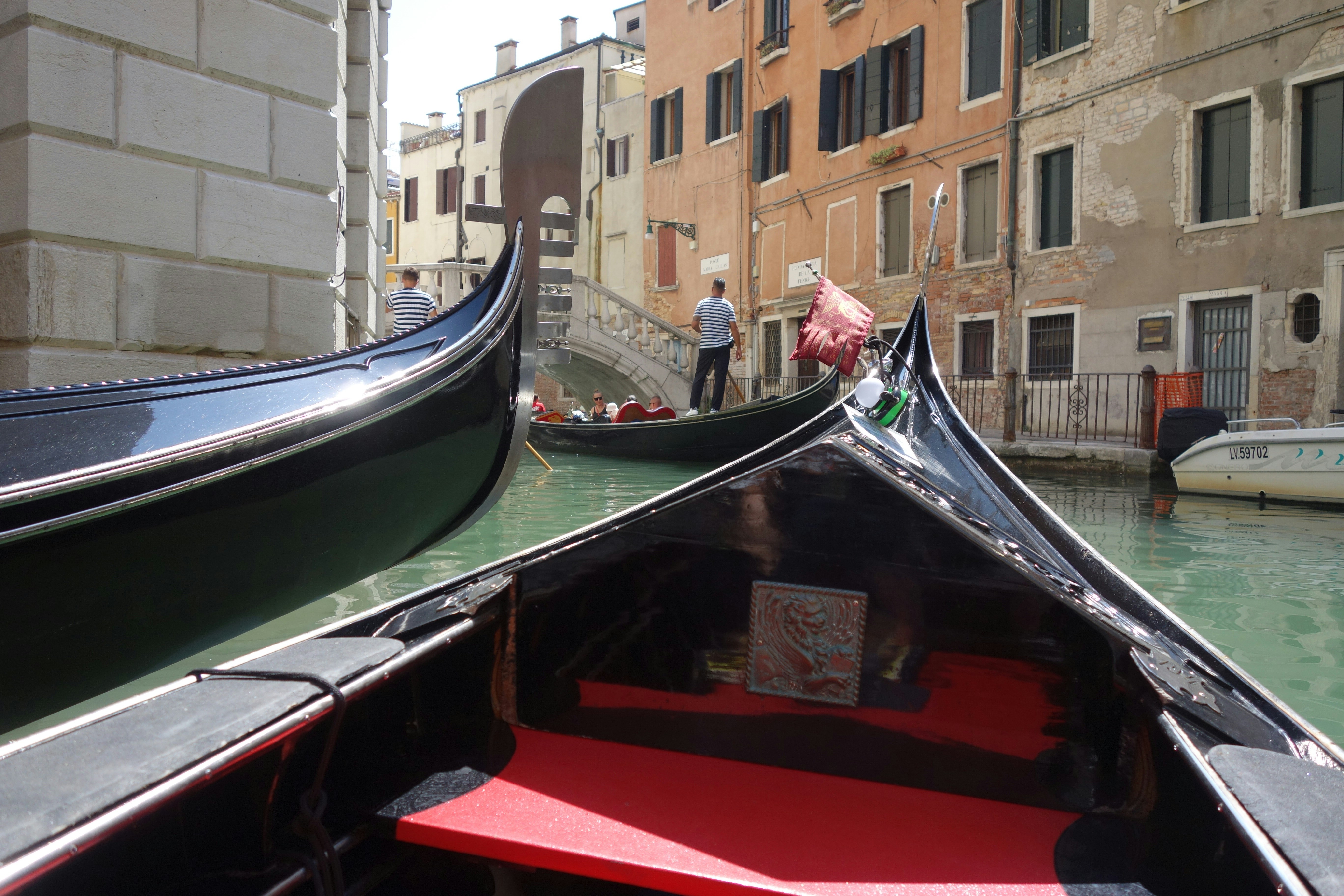 Two gondolas on a canal in venice