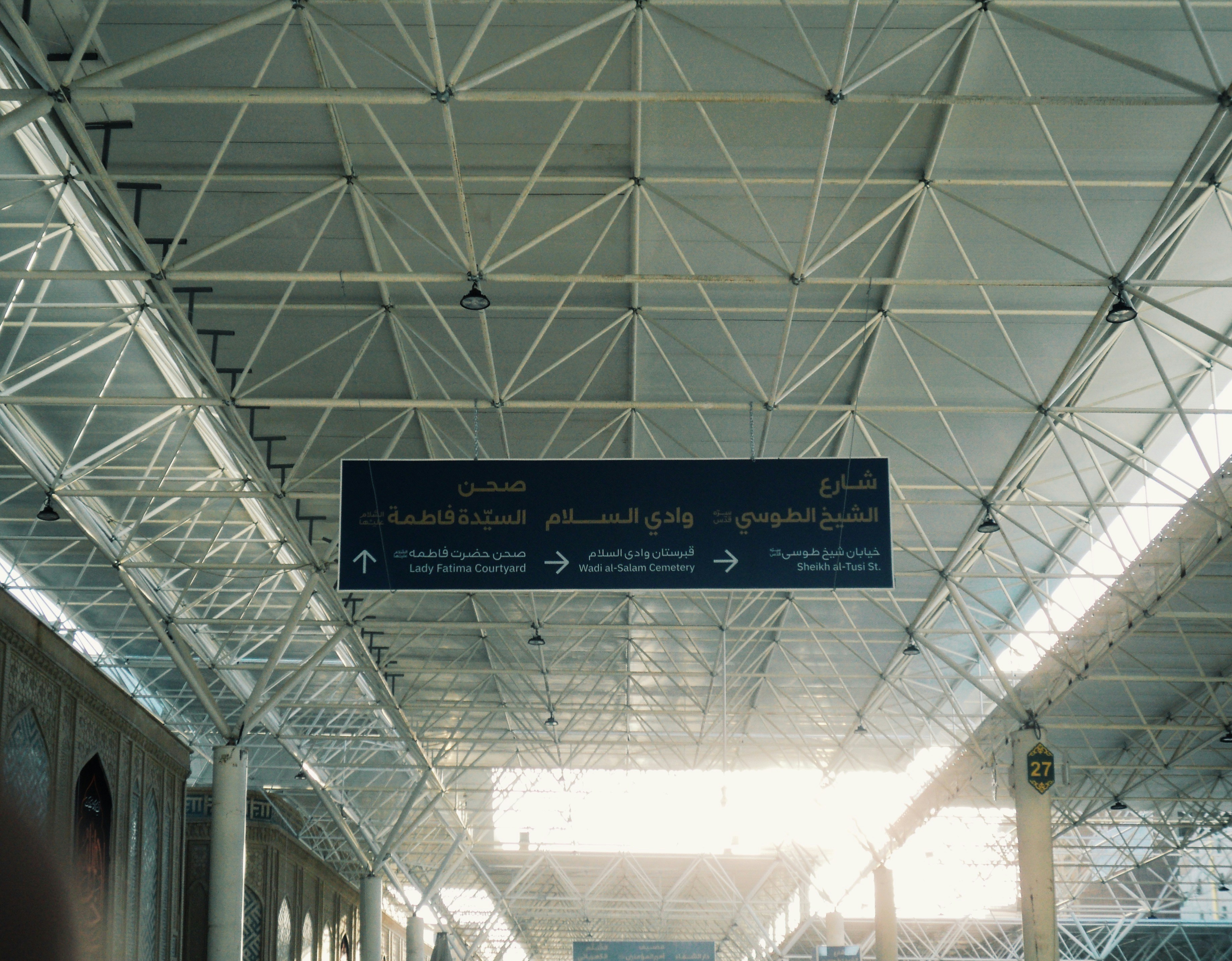 Modern airport ceiling with directional signs