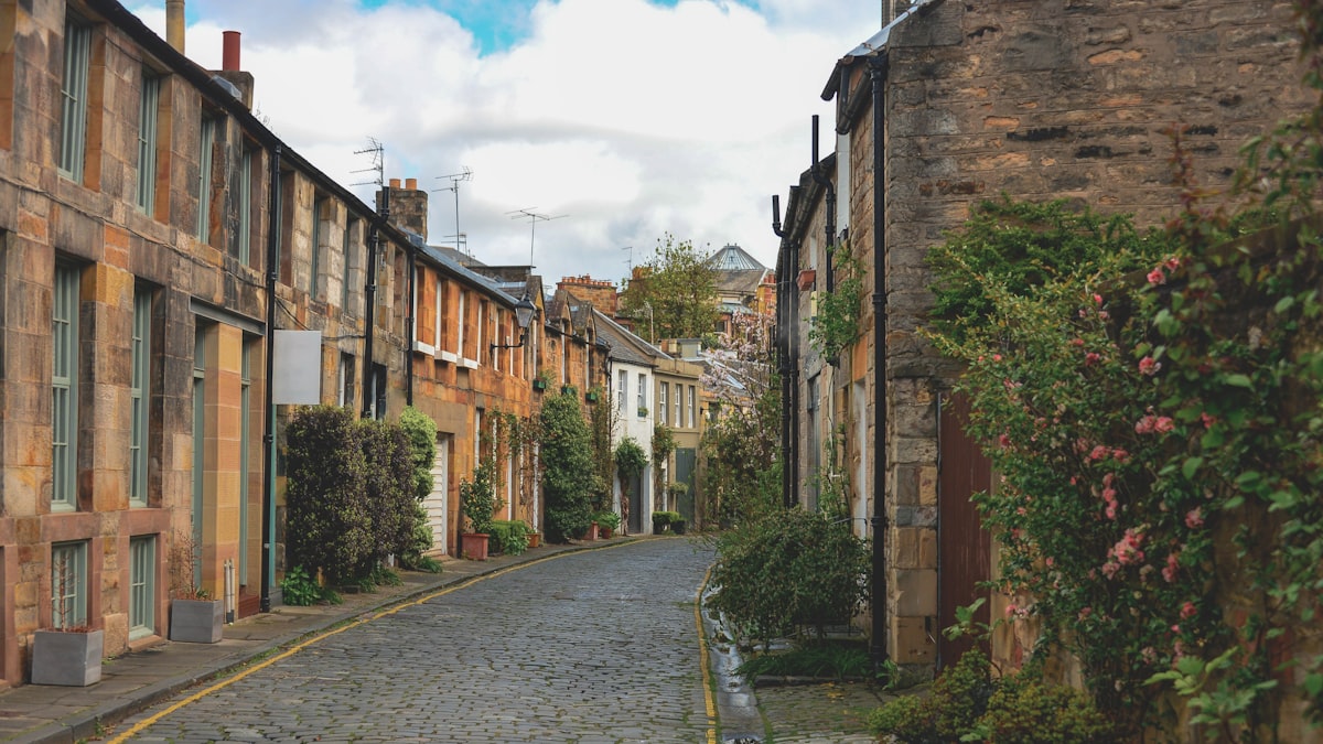 Edinburgh February — a cobblestone street lined with stone houses in the quiet winter city