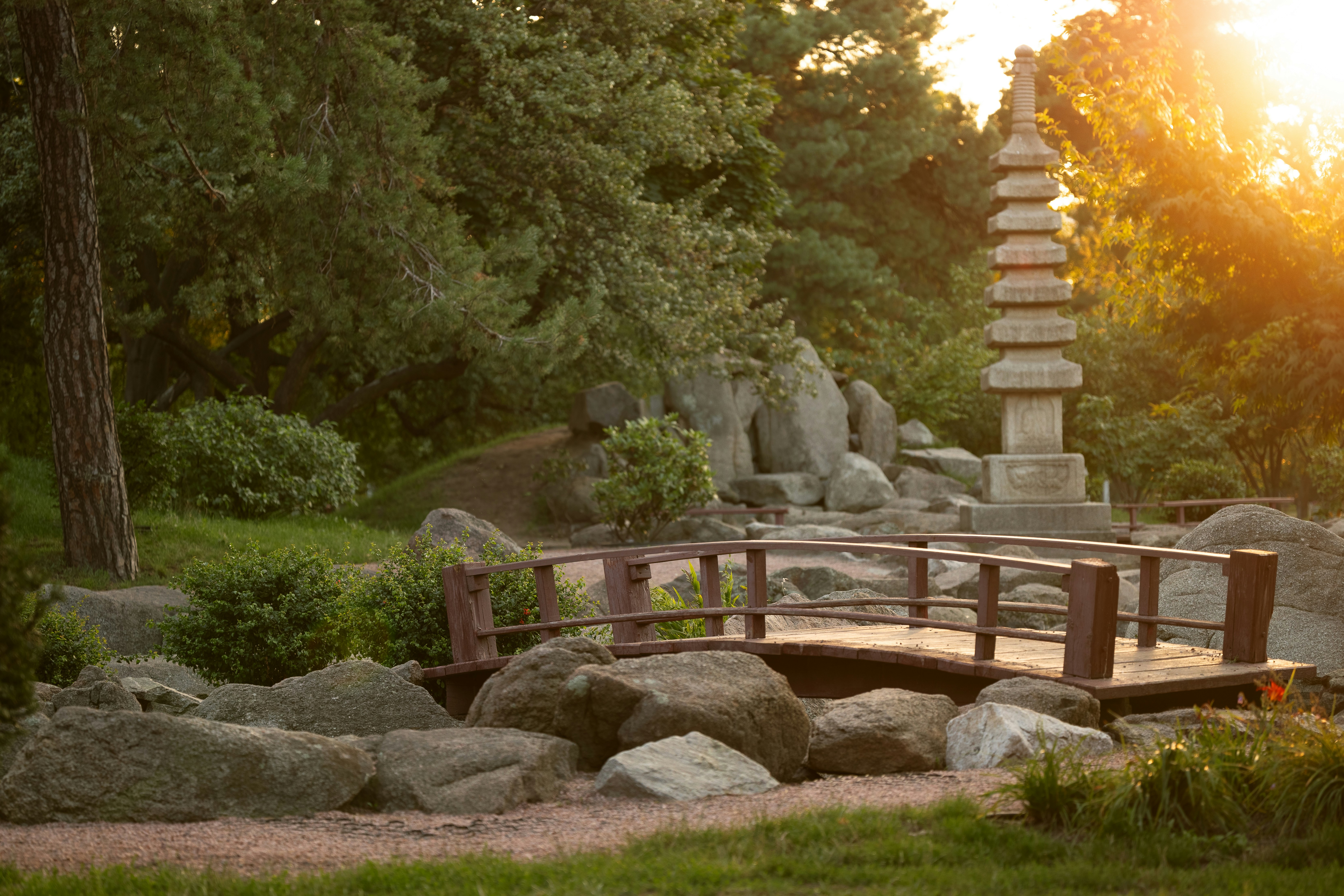 Japanese garden with pagoda and bridge at sunset