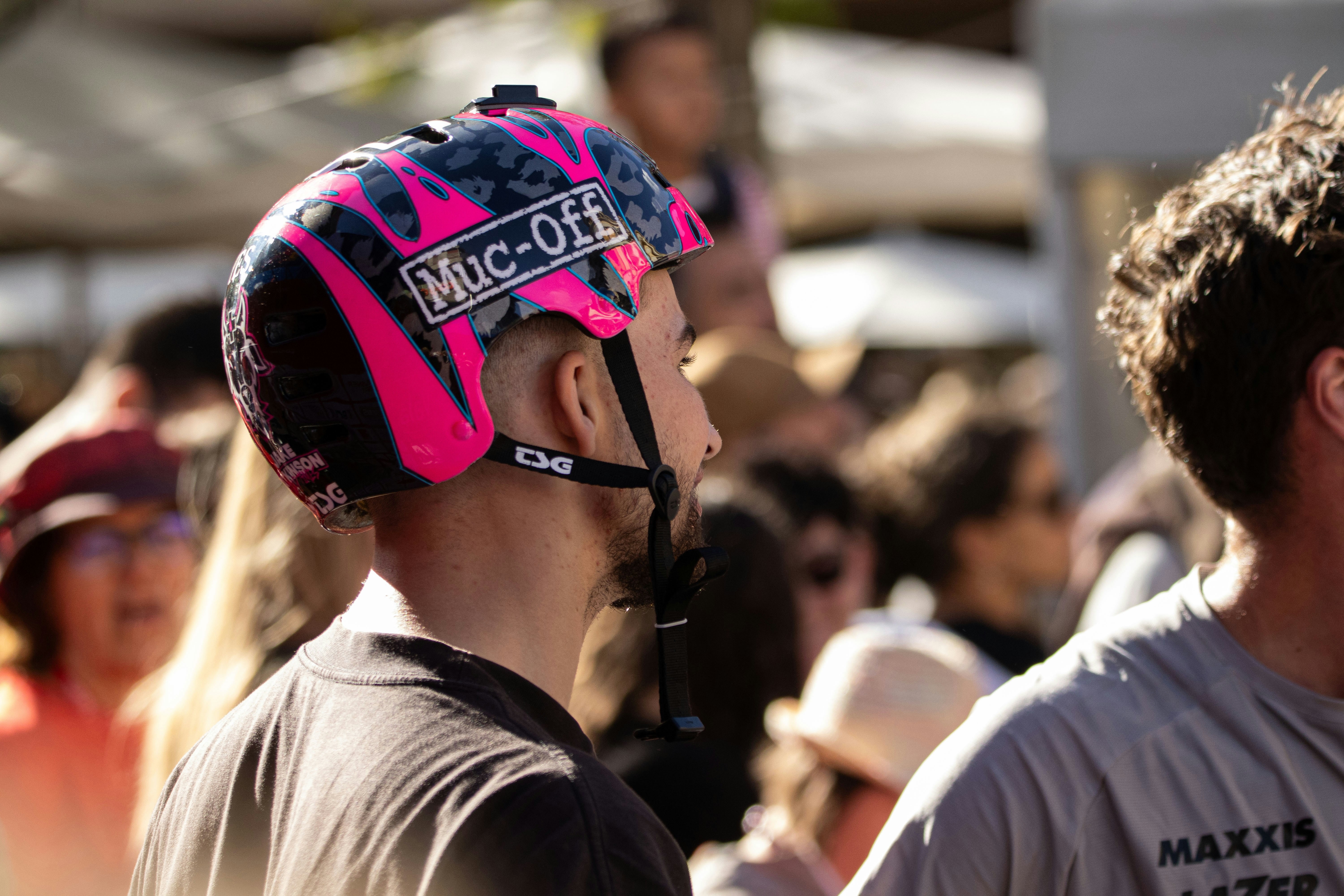 Man wearing a pink and black patterned helmet