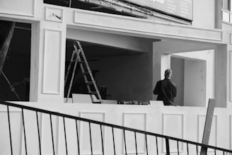 Man standing on balcony during building renovation