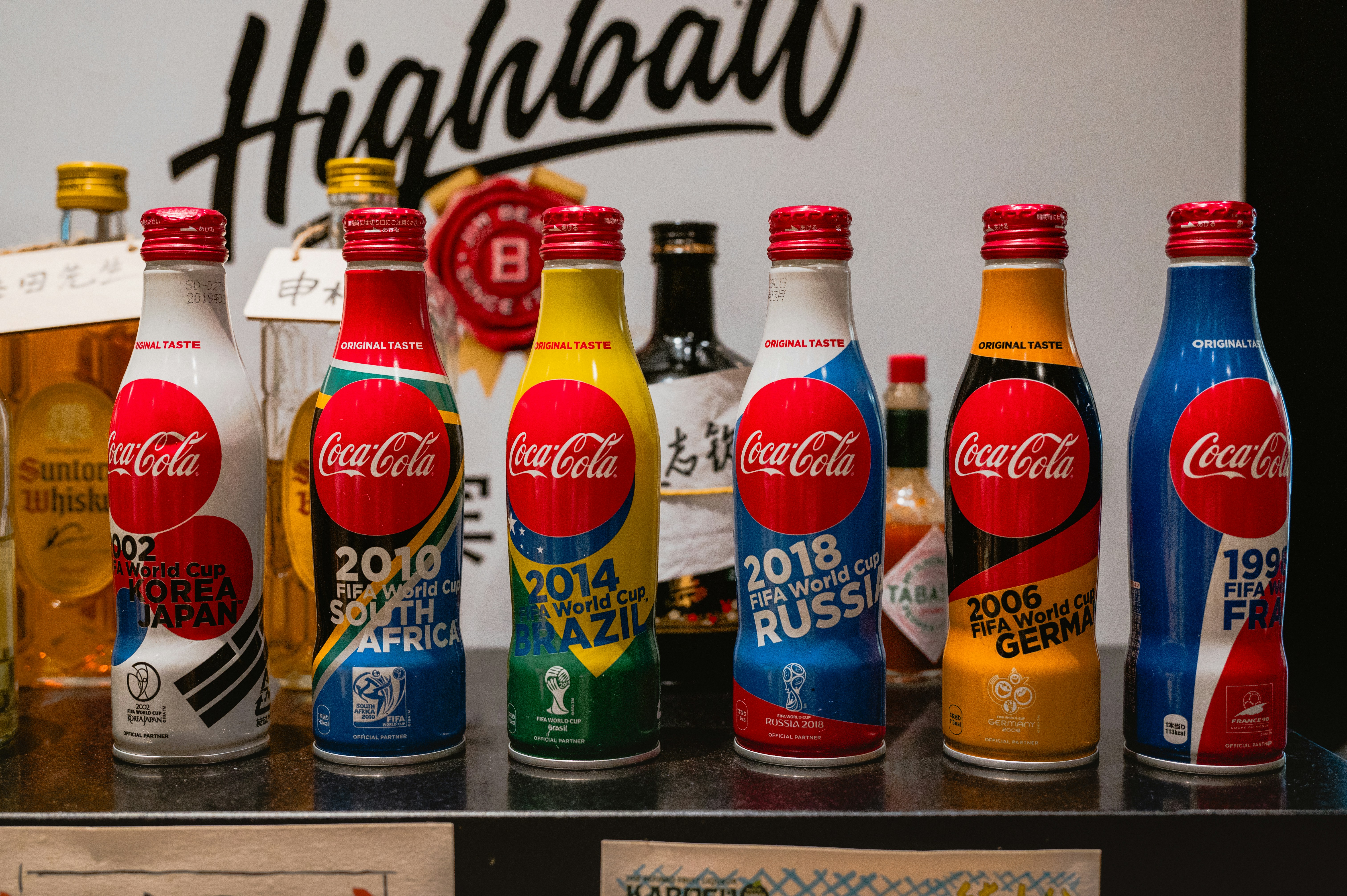 Coca-cola bottles celebrating world cup years and olympic events