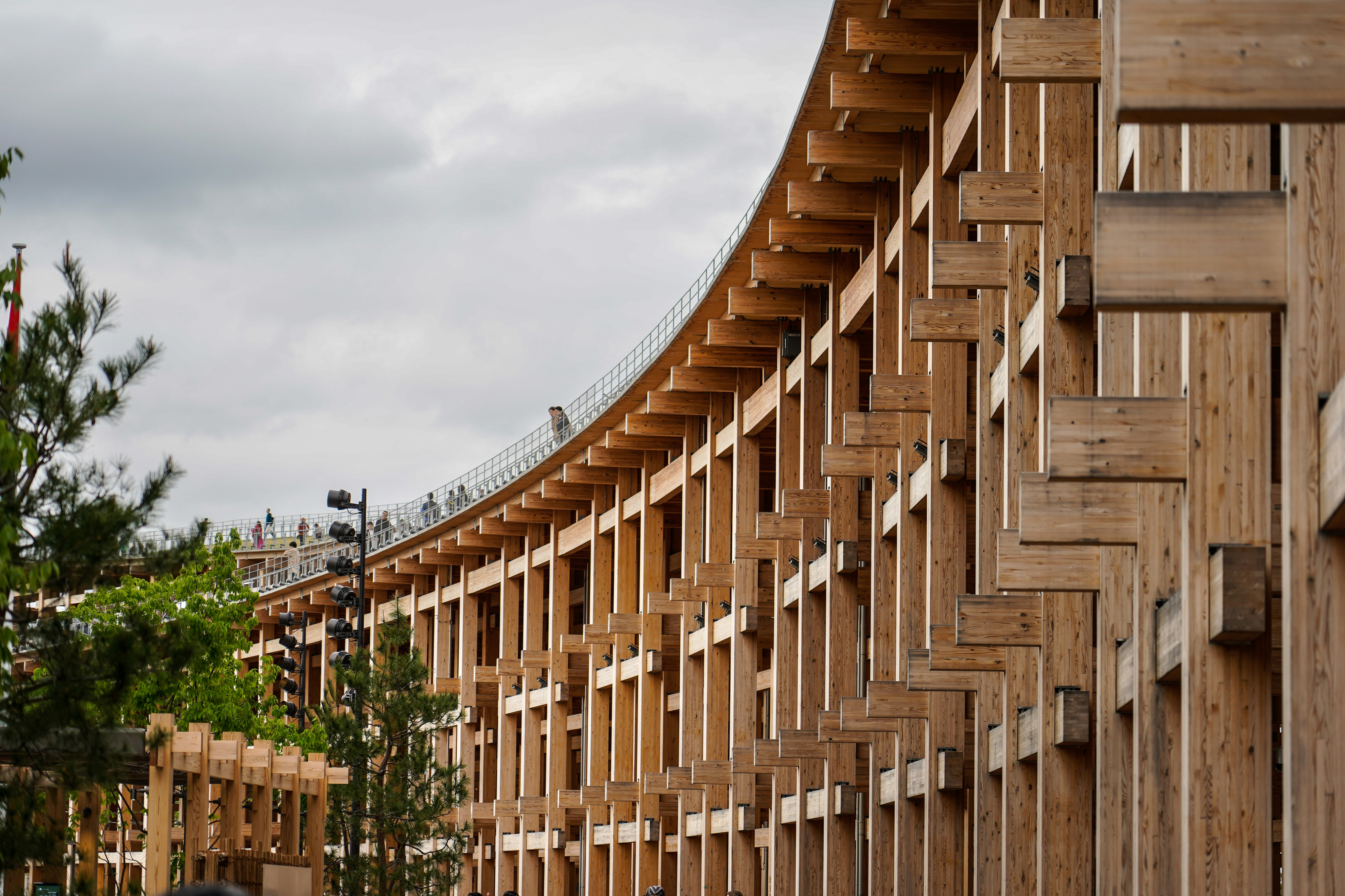 Curved wooden structure with repeating vertical elements