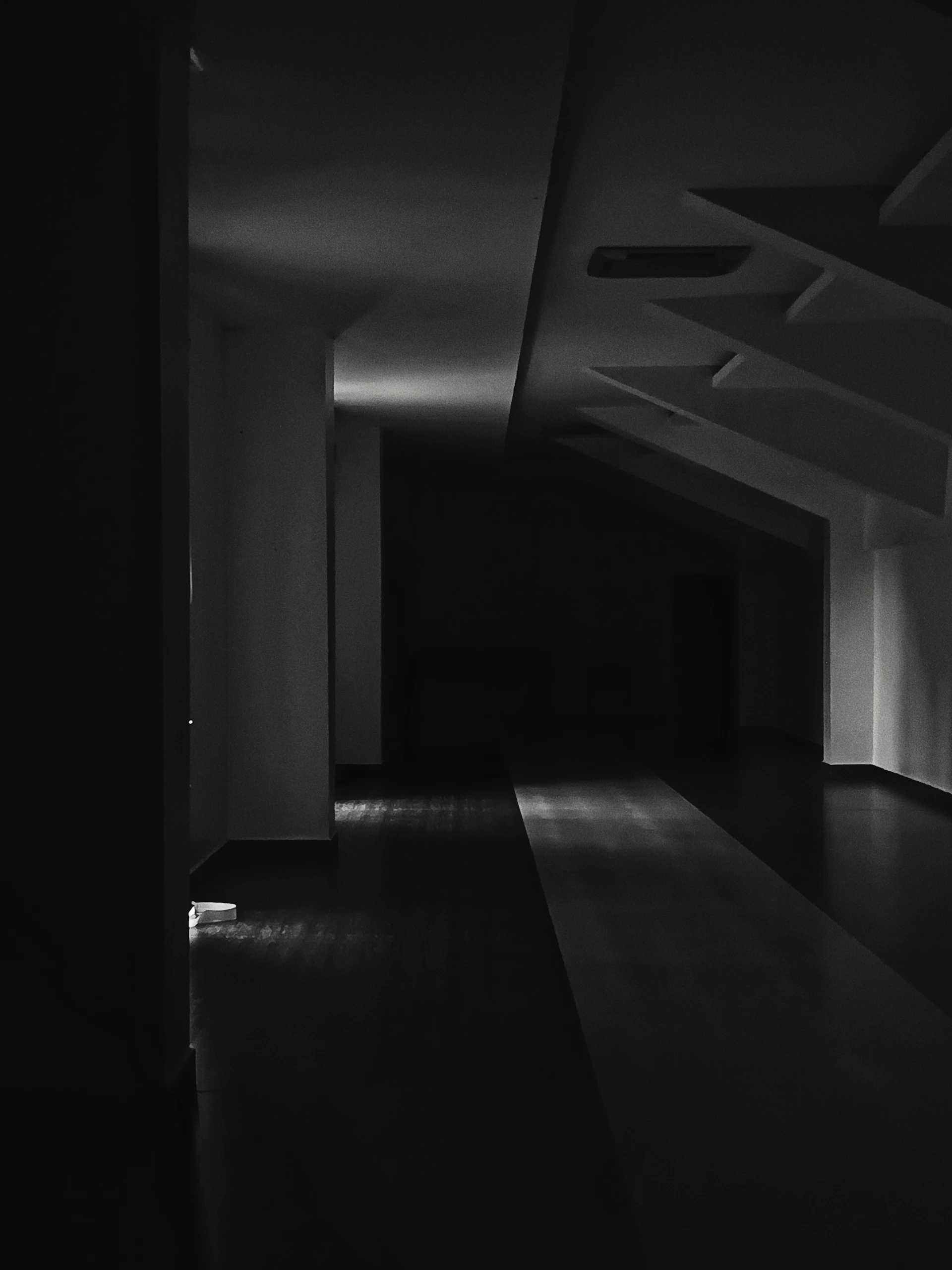 Dark hallway with light illuminating the floor