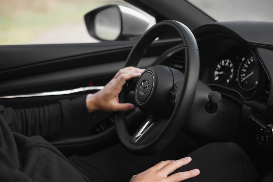 Driver's hand on the wheel at night