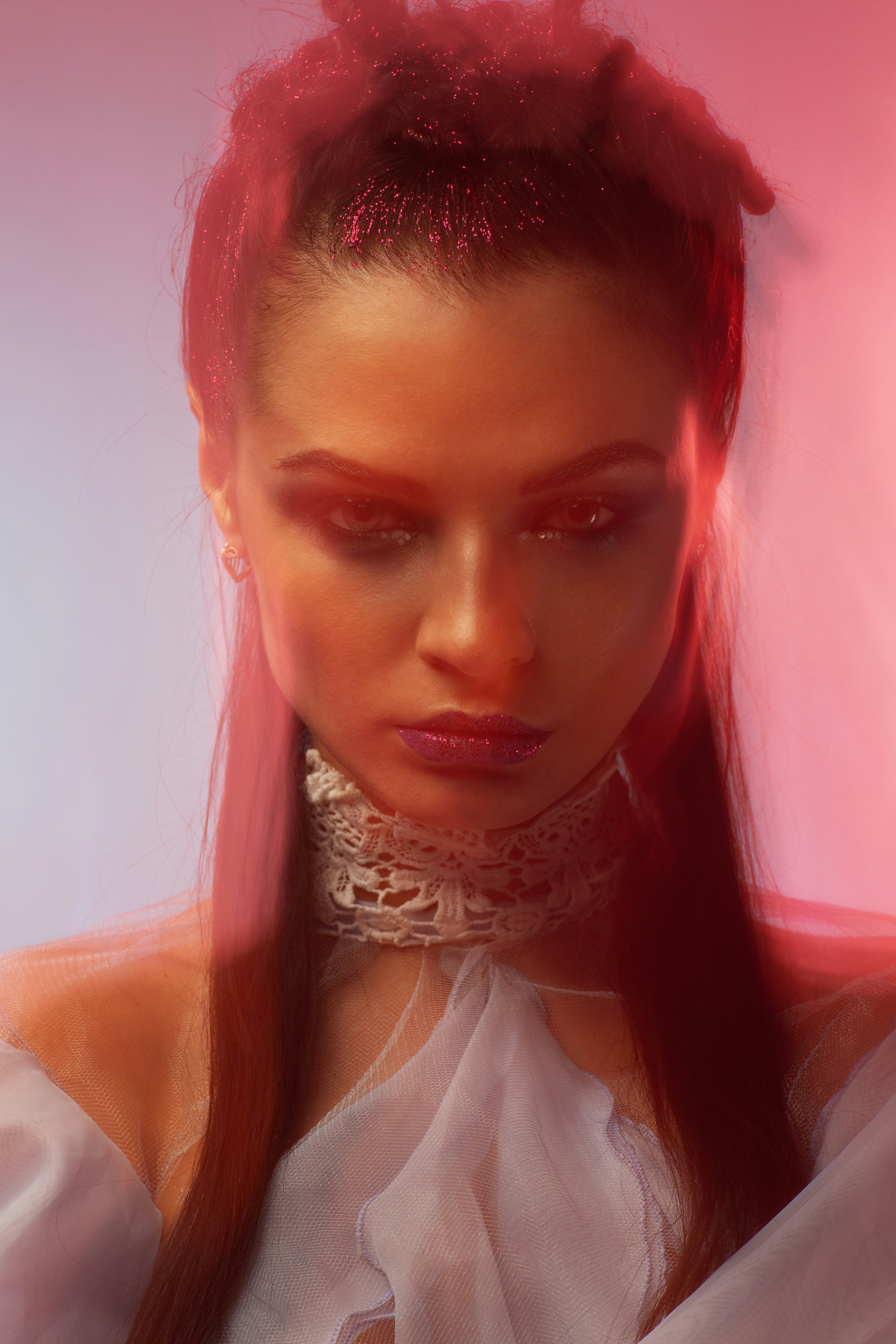 Woman with dramatic makeup and red lighting