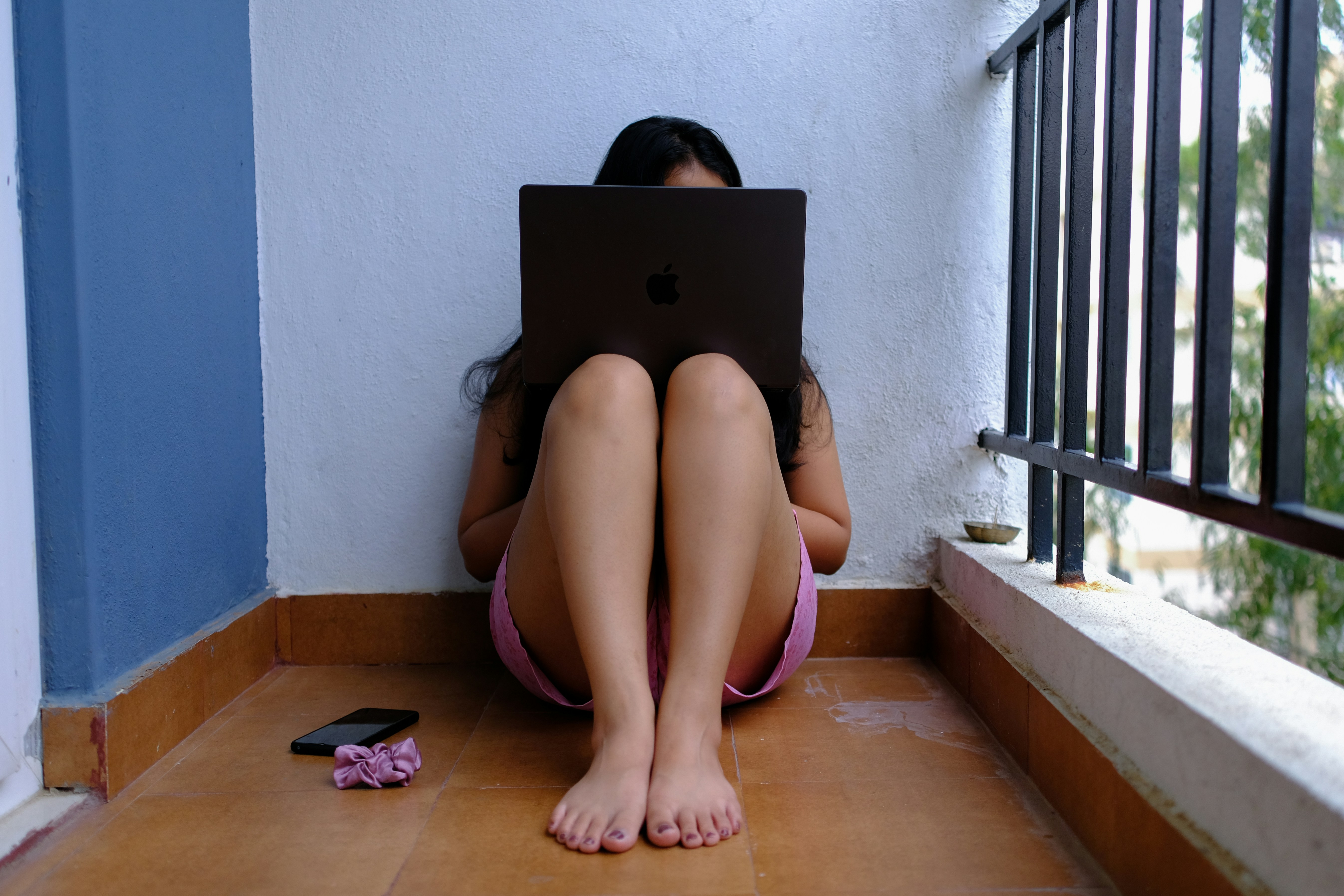 of someone using a laptop for a telehealth appointment at home - Suboxone doctors Tennessee