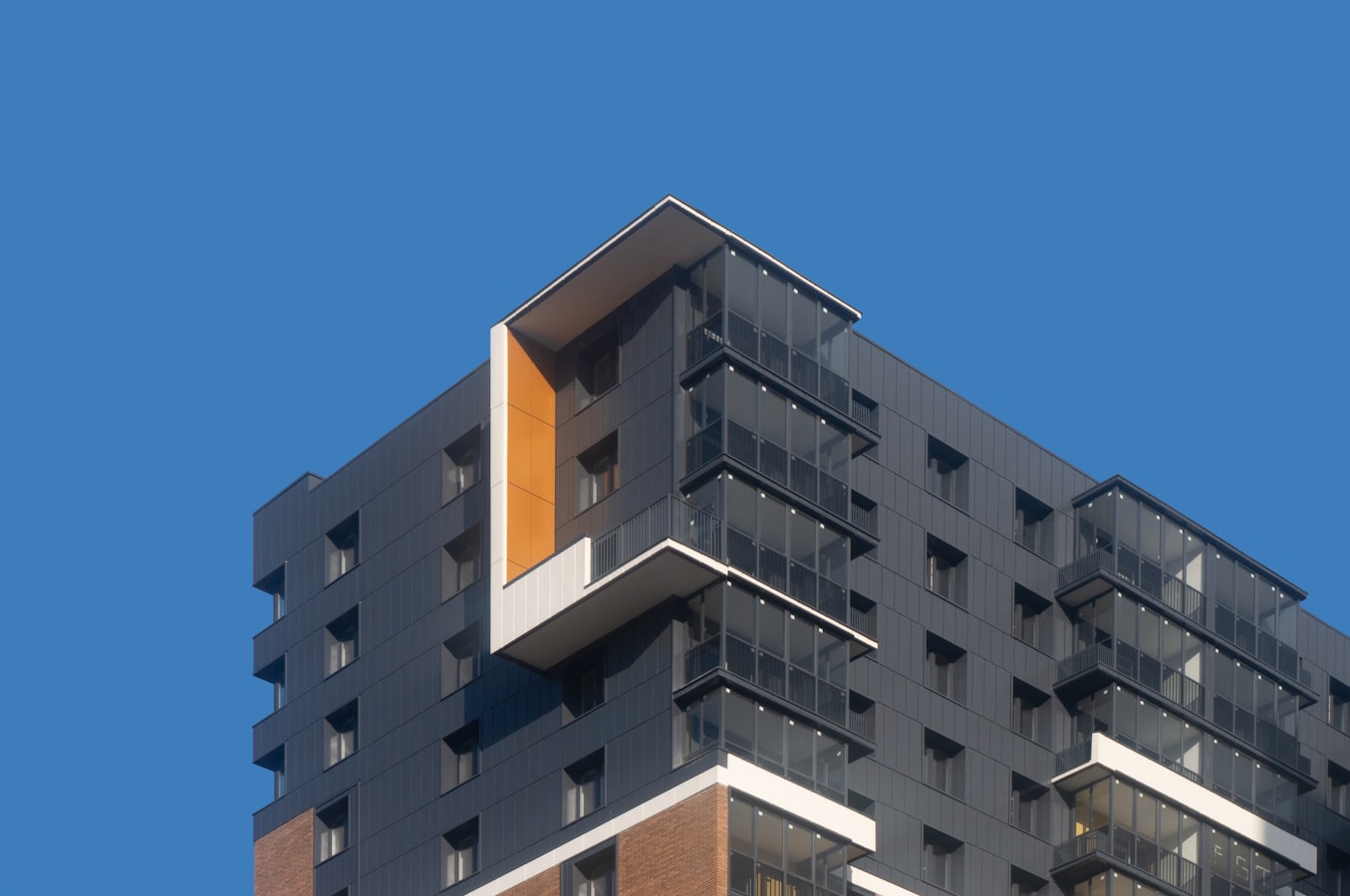 Modern building facade against a clear blue sky