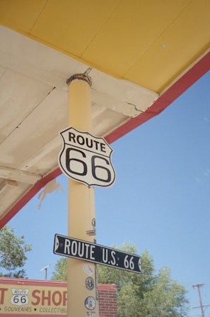 Route 66 sign on a yellow pole