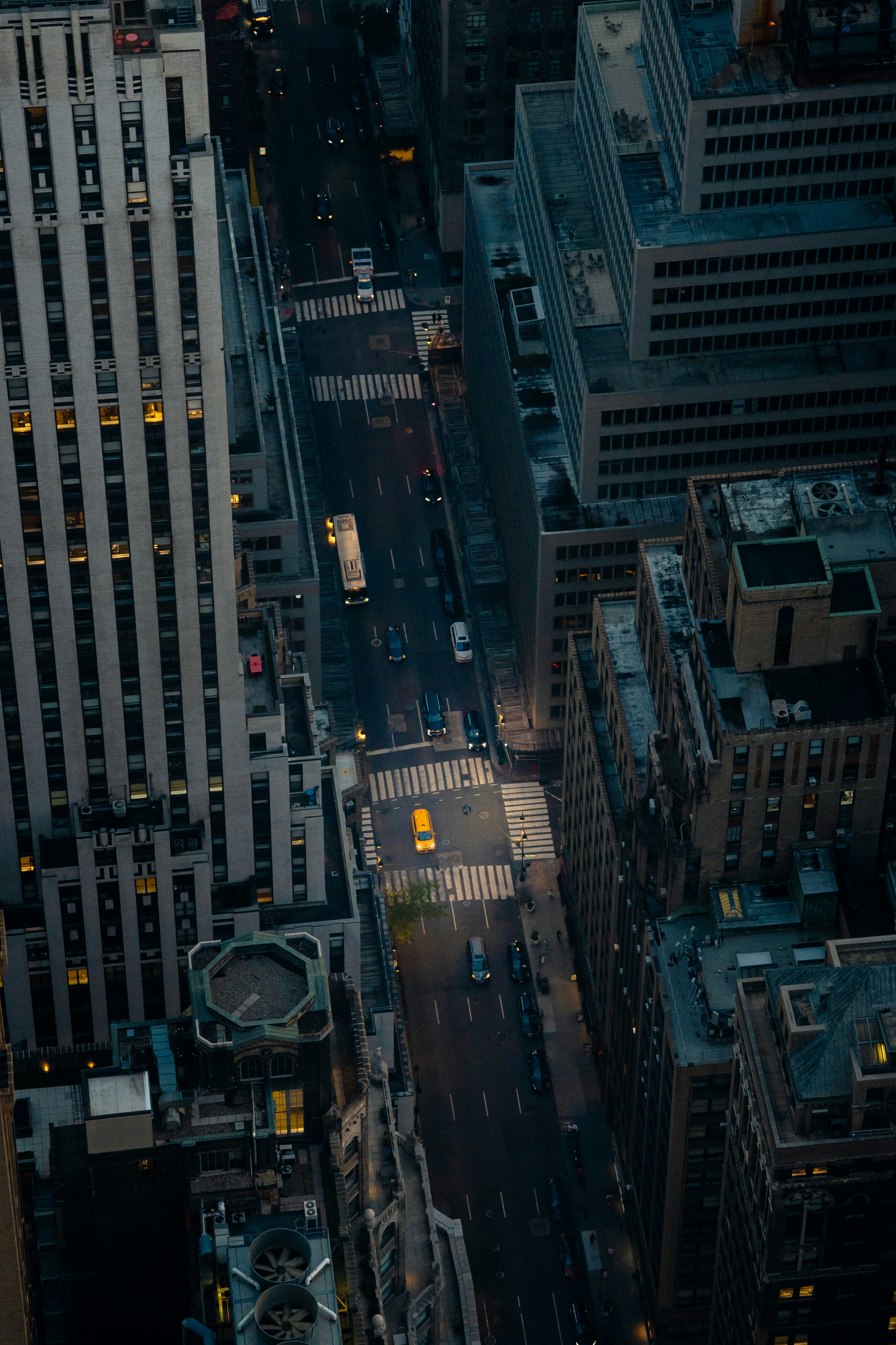 Aerial view of a city street with traffic at dusk