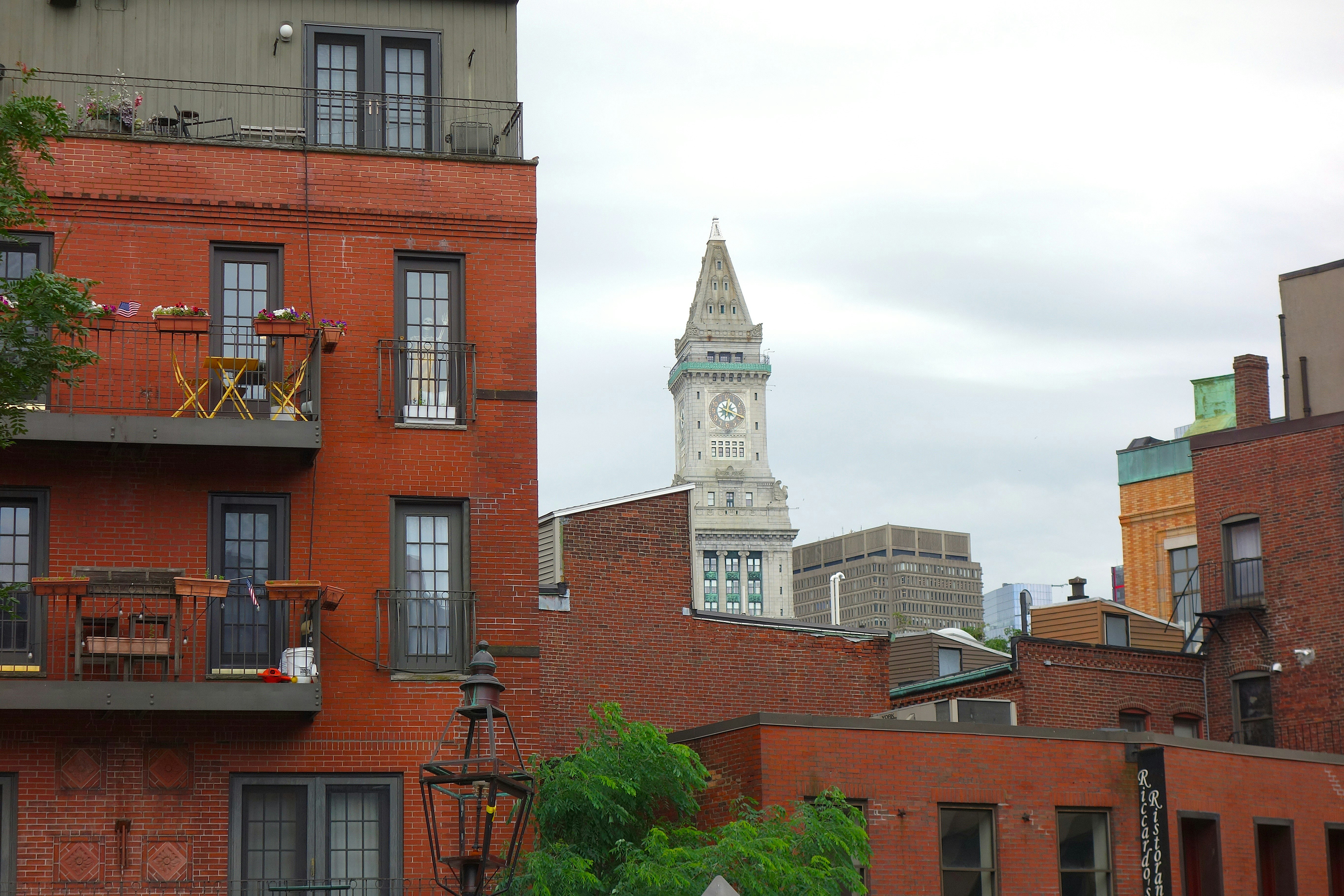 Red brick buildings with a clock tower in boston.
